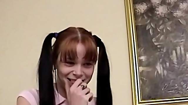 Amateur long haired brunette with pigtails sucks dick close up