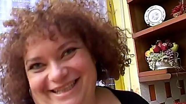 Buxom BBW solo mature model stuffs her pussy with a huge toy