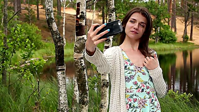 Nelya puts a finger on her clit during the masturbation in the nature