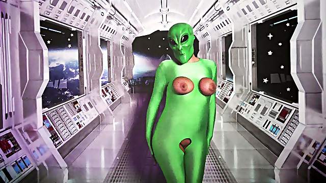 Masked and costumed alien babe with big tits toys her pussy with dildo