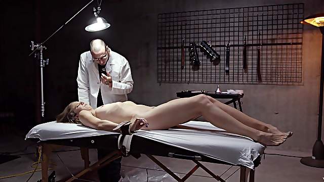 Tied up patient enjoys having her pussy pleasured by a doctor
