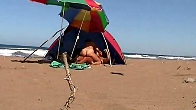 Greek beach sex - hot couple gets fucked in a tent