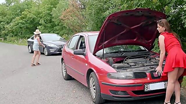 Two blondes have a broken car
