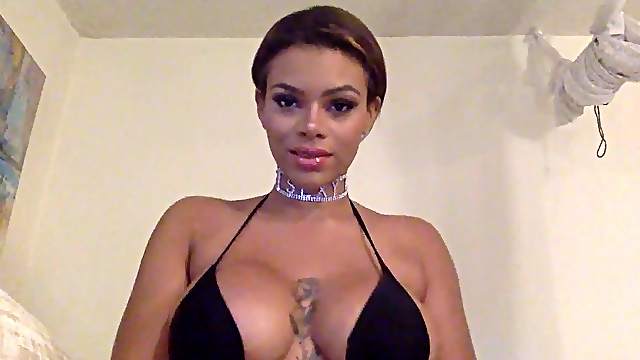 Busty ebony slut Halle Hayes sucks a large dildo while home alone