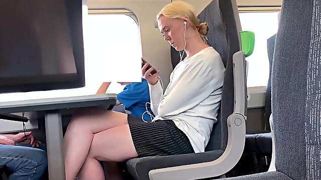 Blonde with beautiful legs on the train