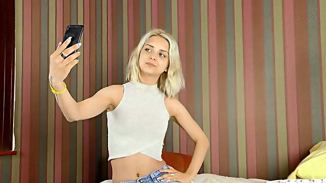 Naughty model Jenny Wilson pleasures her pussy for the camera