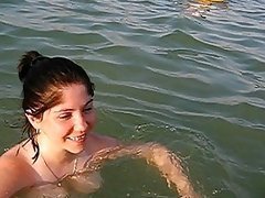 Naturally Busty Brunette Swimming Topless at the Beach