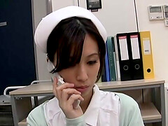 Horny Japanese nurse Anna Noma moans while playing with a dildo