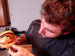 Handsome dude enjoys while making dinner for his girlfriend