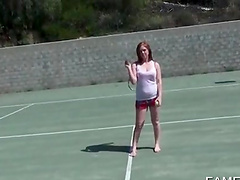Sporty redhead hottie shows sexy tits outdoor