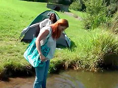 WAM appealing clothed babe gets wet in the lake