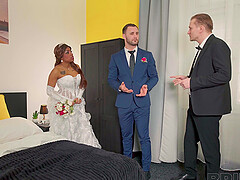 A beautiful black bride Vicky Menage gets married to a white man in a captivating scene.