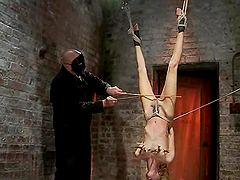 Gorgeous Rene Phoenix is being suspended upside down
