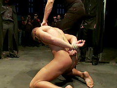 He is chained and suspended around some faggots
