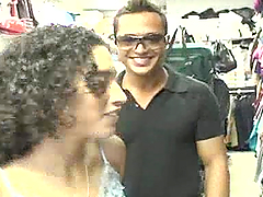 Curly-haired Latina Selena strips and gives a blowjob to a man