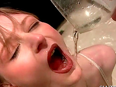 Kinky blonde tramp filling three glasses with her piss