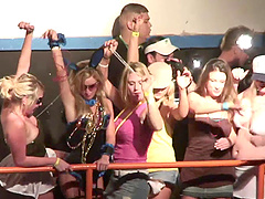 Doting babes showing off their nice tits in public at wild party
