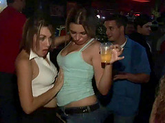 Amateur blonde flashes her big natural tits in a club's loo