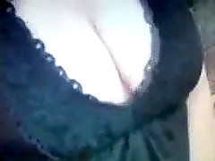 Kinky girl pulls her thong aside and fingers her shaved pussy