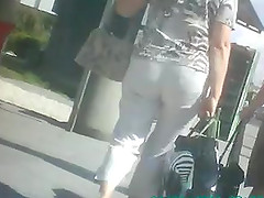 A gal wearing a miniskirt gets caught on a voyeur's cam