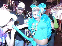 Chubby cougar flashing her huge tits at partygoers