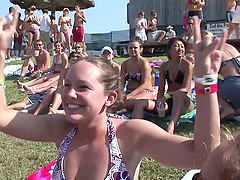 Outdoor reality clip with chicks wearing bikinis having fun at a party