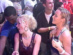 Sexy chick wearing a minidress flashes her butt in a club