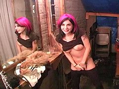 A pink haired goth hottie gets naked and rides a motorcycle