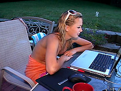 Blonde slut chatting on the computer while her tits are out
