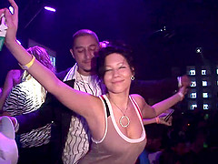 Sexy brunette with a curvy body flashing her big tits in public
