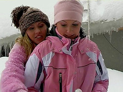 Lesbian chicks warming up by having sex outdoors in the snow