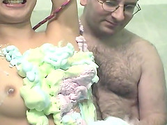 Asian babe roped up and covered in cream