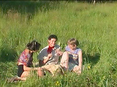 Mature ladies utterly devour his dick in a grassy field