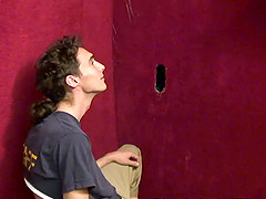 Sexy white gay boy sucks a black cock at the gloryhole