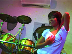 Sexy babe erotically strips to th e soothing beats of the music