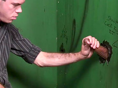 Gay guy sucks a rock hard cock at the gloryhole