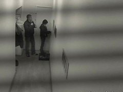 Mischievous Brunette Boldly Bangs in a Public Hallway