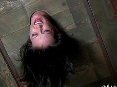 BDSM porn shoot of brunette slave yelling when spanked