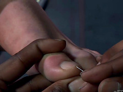 Tortured slave spreading legs seductively in BDSM porn