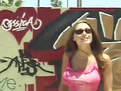 Brunette natural tits caressed in public porn scene