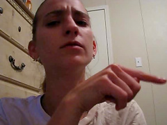 Brown-haired amateur girl has fun in front of a webcam