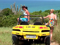Tarra White and Aneta Keys take a leisurely stroll along the beach.