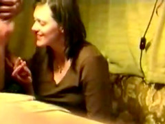 Brunette milf giving some guy head without any idea she is being filmed.