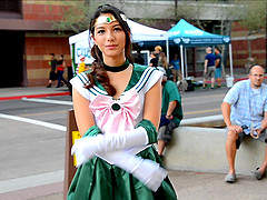 Beautiful girl Melody wears a costume while she walks outdoors