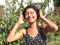 Young girl masturbates in the nature usig a vibrator and fingers