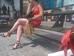 Woman with chubby sexy legs on bus stop