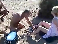 Voyeur masturbates on the beach