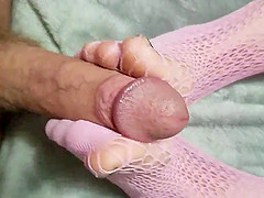 Kinky girl loves teasing a guy by jerking him off with her feet